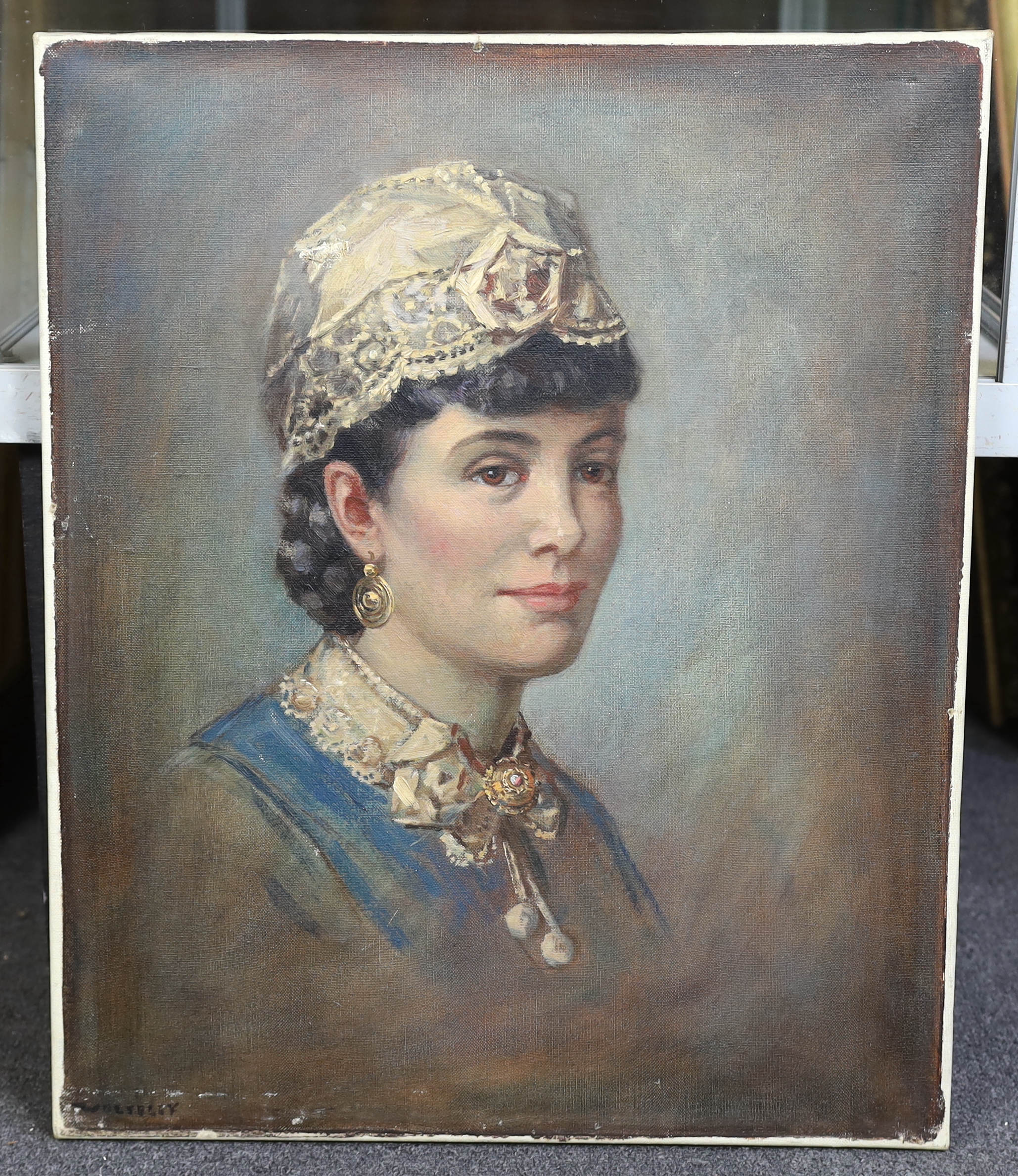 Garnet Ruskin Wolseley (English, 1884-1967), oil on canvas, Portrait of a lady wearing a lace cap, signed, 59 x 48cm. Condition - fair, other than damage to canvas to the cap